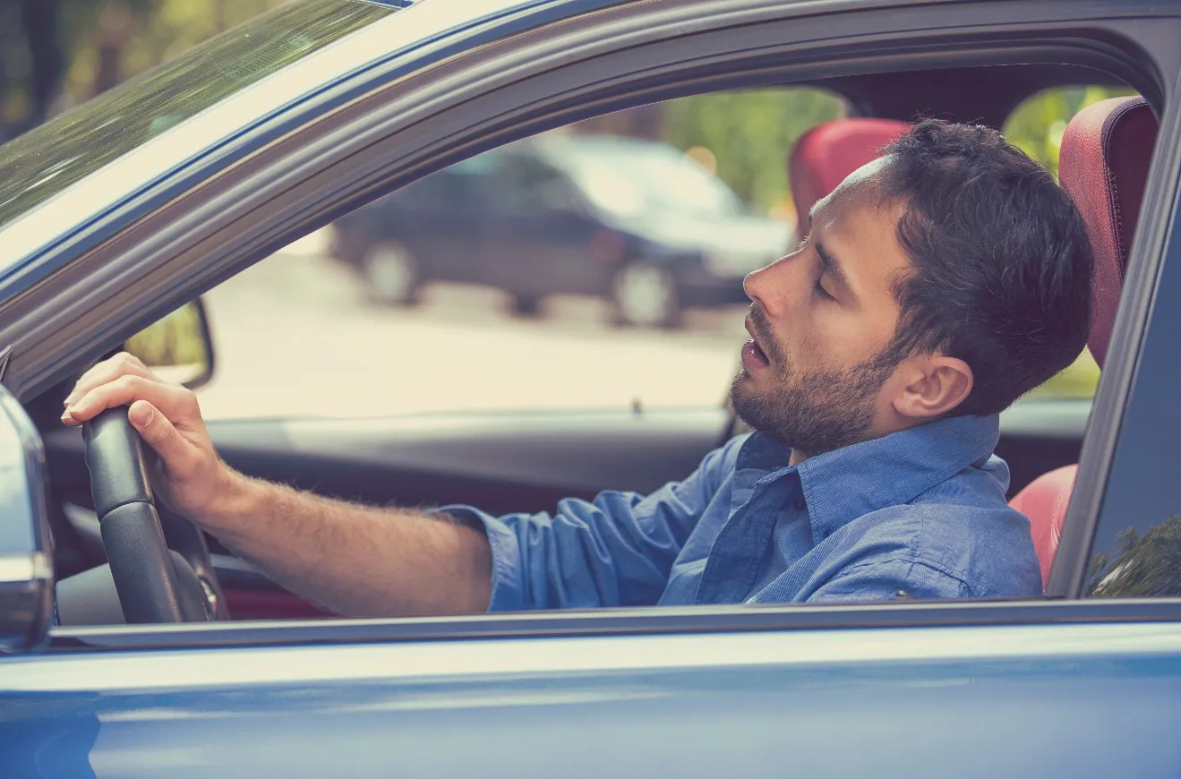 An image containing car, man, person, mirror